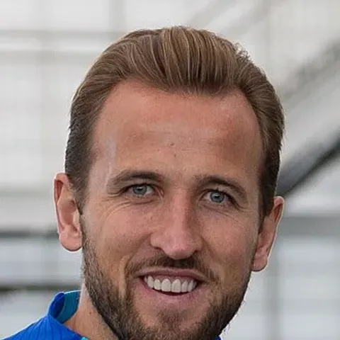 Harry Kane in England red captain's armband — the Bayern Munich striker leads Thomas Tuchel's 26-man England squad for the 2026 World Cup announced at Wembley on May 22, with Cole Palmer, Phil Foden and Harry Maguire among the most-debated omissions